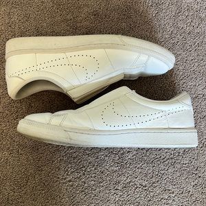 Nike white slip ons. Slightly worn. Size 7